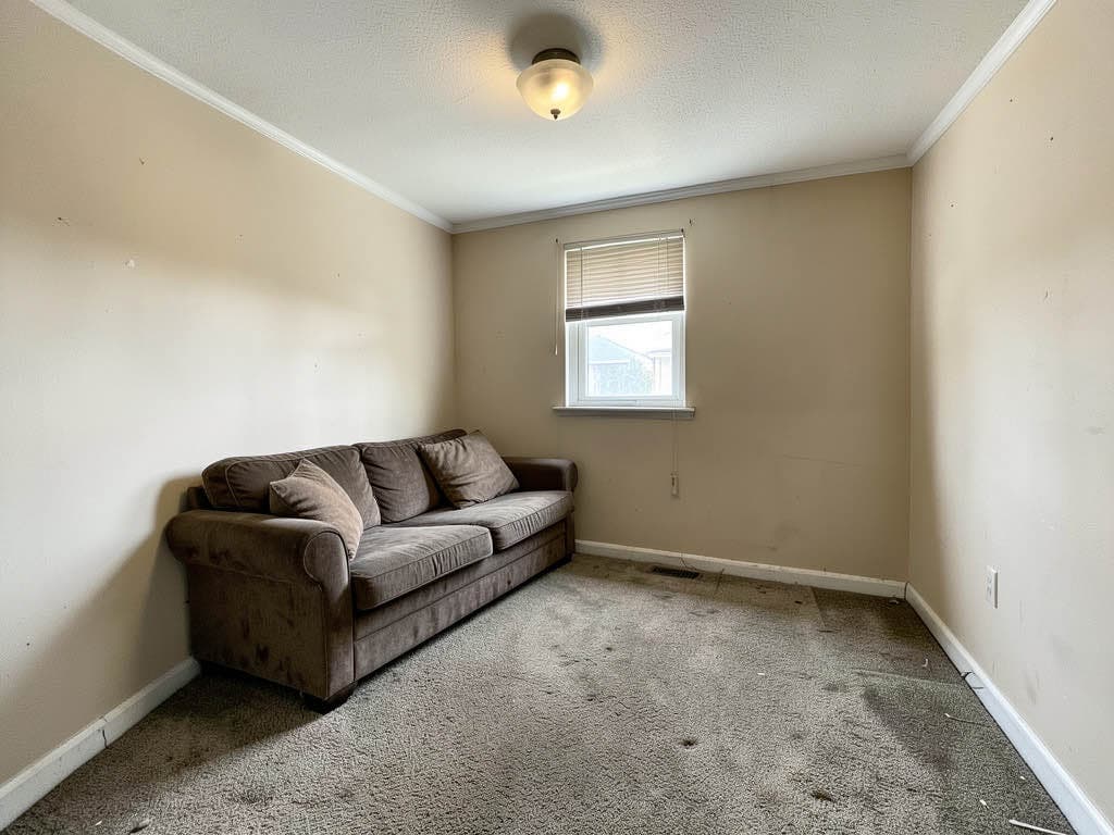 An empty living room before redesign.